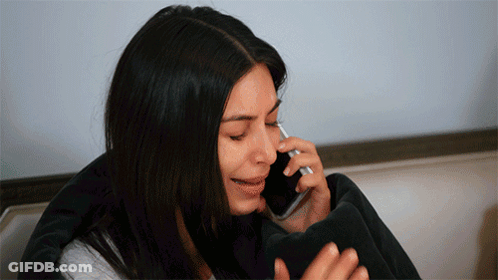 A Woman Is Crying While Talking On A Cellphone GIF