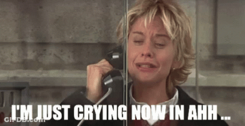 A Woman Is Crying While Talking On A Phone With The Caption I 'M Just Crying Now In Ahh GIF