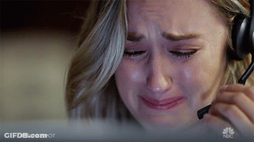 A Woman Is Crying While Wearing A Headset And The Nbc Logo Is Visible Behind Her GIF