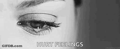 A Woman Is Crying With A Tear Coming Out Of Her Eye In A Black And White Photo . GIF