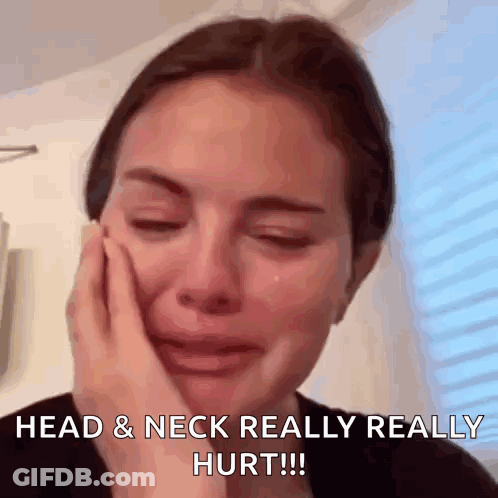A Woman Is Crying With Her Hand On Her Face And The Caption Reads Head & Neck Really Really Hurt GIF