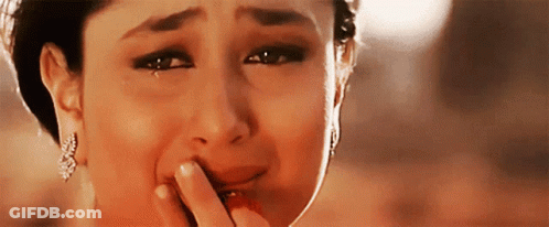 A Woman Is Crying With Tears Coming Out Of Her Eyes . GIF