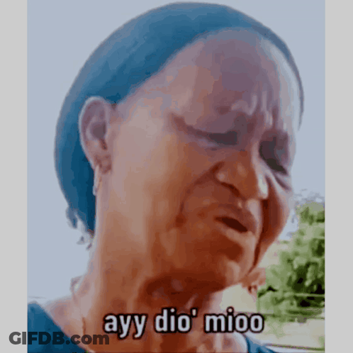 A Woman Is Crying With The Words Ayy Dio Mioo Written On Her Face . GIF