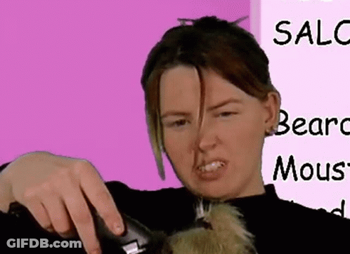 A Woman Is Cutting A Dog 'S Hair In Front Of A Pink Sign That Says Sale Bears Mous GIF