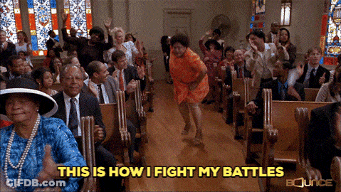 A Woman Is Dancing In A Church With The Words " This Is How I Fight My Battles " Below Her GIF