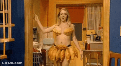 A Woman Is Dancing In A Kitchen Wearing A Dress Made Of Potatoes . GIF