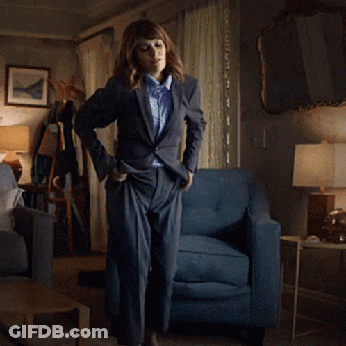 Woman Dancing In Living Room With Blue Chair GIF