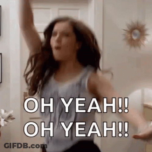 A Woman Is Dancing In A Living Room With Her Arms In The Air And The Words `` Oh Yeah ! Oh Yeah ! '' GIF