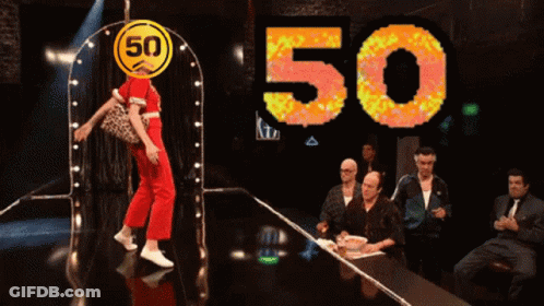 A Woman Is Dancing In Front Of A 50 Sign GIF