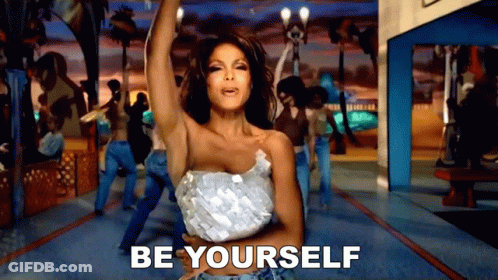 A Woman Is Dancing In Front Of A Crowd And The Words Be Yourself Are On The Bottom GIF
