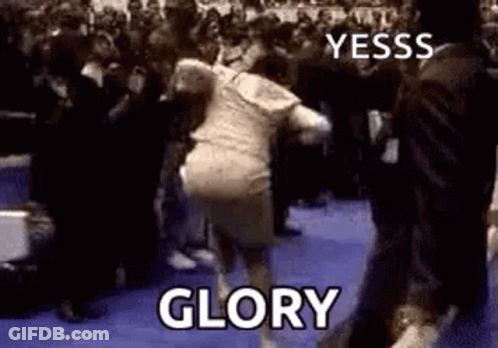 A Woman Is Dancing In Front Of A Crowd With The Words `` Glory '' Written On The Bottom . GIF