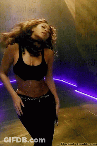 A Woman Is Dancing In Front Of A Wall With The Words Flycandy.tumblr.com On It GIF