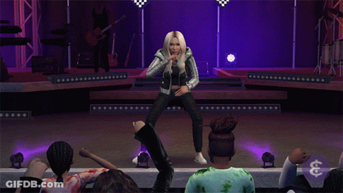 A Woman Is Dancing On A Stage In Front Of A Crowd With A Dollar Sign In The Lower Right Corner GIF