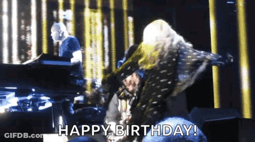 A Woman Is Dancing On A Stage With The Words Happy Birthday Written Below Her GIF