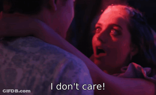 A Woman Is Dancing With A Man And Says I Do N't Care GIF