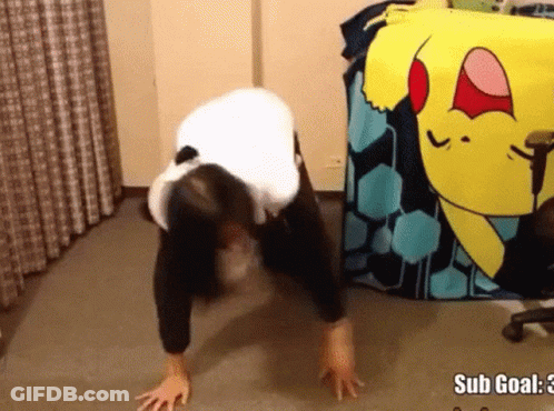 A Woman Is Doing Push Ups In Front Of A Pokemon Blanket That Says Sub Goal GIF