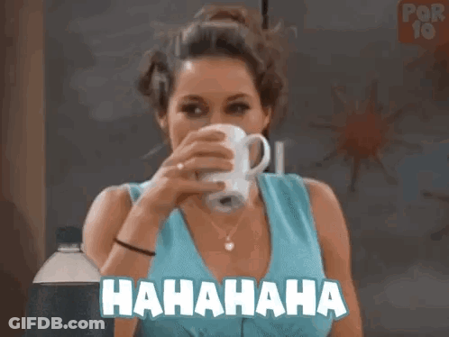 A Woman Is Drinking A Cup Of Coffee And Laughing While Holding A Bottle . GIF