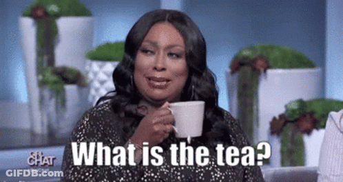 A Woman Is Drinking A Cup Of Tea And Saying What Is The Tea . GIF