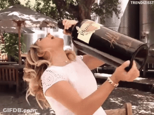 A Woman Is Drinking From A Large Bottle Of Plum Wine GIF