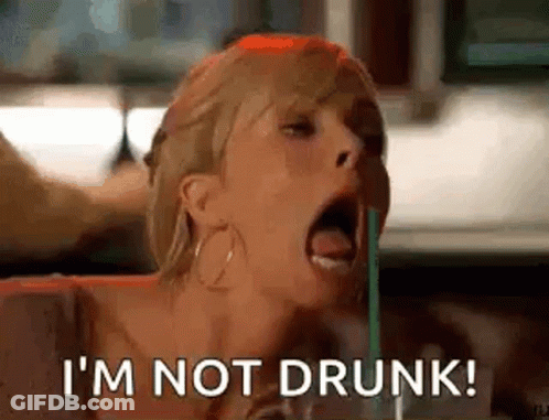 A Woman Is Drinking Through A Straw And Saying I 'M Not Drunk . GIF