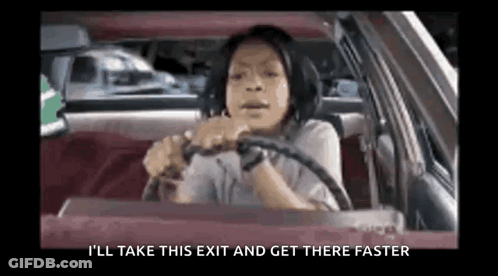 A Woman Is Driving A Car With The Words `` I 'Ll Take This Exit And Get There Faster '' On The Screen . GIF