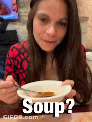 A Woman Is Eating A Bowl Of Soup With The Words Soup Written Below Her GIF