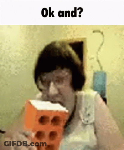 A Woman Is Eating A Brick With The Words Ok And Behind Her GIF