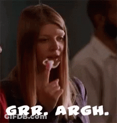A Woman Is Eating A Piece Of Food And The Words Grrr Argh Are On The Bottom Of The Picture . GIF