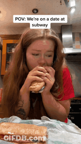 A Woman Is Eating A Subway Sandwich With A Caption That Says Pov We 'Re On A Date At Subway GIF