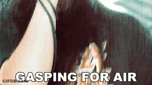 A Woman Is Gasping For Air While Holding A Dog 'S Head GIF