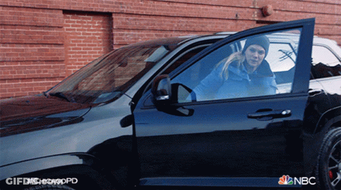 A Woman Is Getting Out Of A Nbc Chicago Police Car GIF