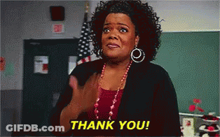 A Woman Is Giving A Thank You Gesture In Front Of An American Flag GIF