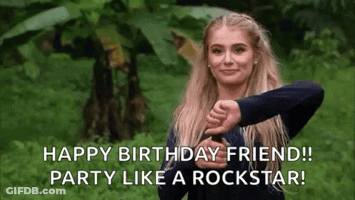 A Woman Is Giving A Thumbs Down Sign In Front Of A Forest . GIF