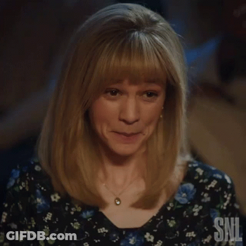 A Woman Is Giving A Thumbs Up And Smiling . GIF