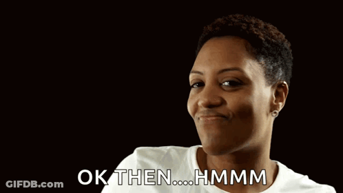A Woman Is Giving A Thumbs Up With The Words Ok Then Hmmm Behind Her GIF