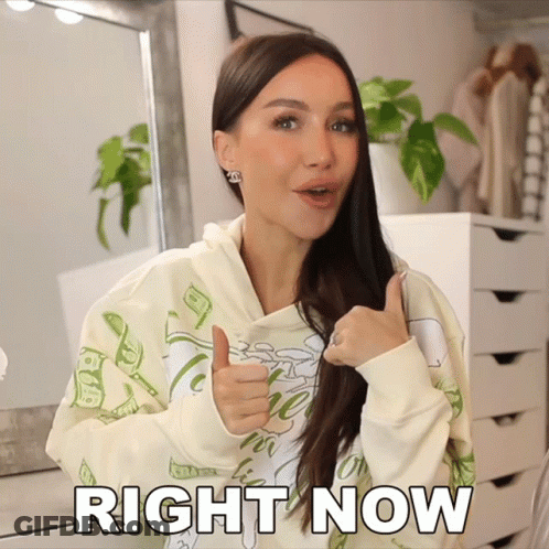 A Woman Is Giving A Thumbs Up With The Words Right Now Written Below Her GIF