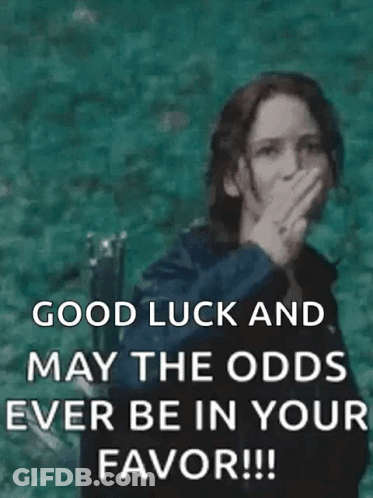 A Woman Is Giving The Middle Finger And Saying `` Good Luck And May The Odds Ever Be In Your Favor !! '' GIF