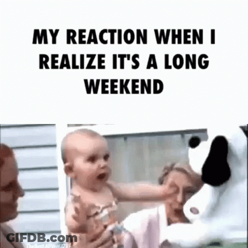 A Woman Is Holding A Baby In Her Arms While A Stuffed Animal Looks On . GIF
