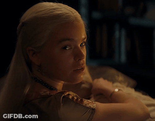 A Woman Is Holding A Baby Who Is Sleeping GIF