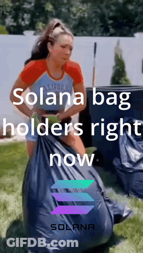 A Woman Is Holding A Bag That Says Solana Bag Holders Right Now On It GIF