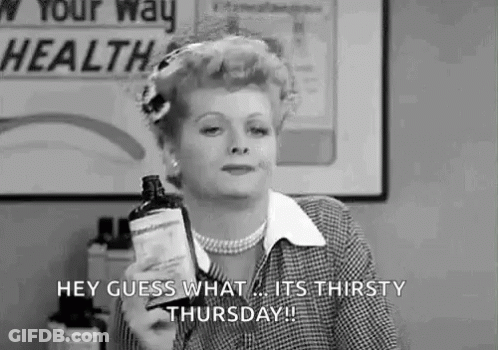 A Woman Is Holding A Bottle Of Medicine And Saying `` Hey Guess What ... It 'S Thirsty Thursday '' . GIF