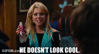 A Woman Is Holding A Bottle Of Soda And Says `` He Doesn 'T Look Cool '' . GIF