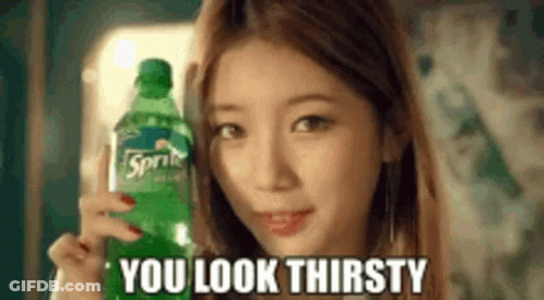 A Woman Is Holding A Bottle Of Sprite In Her Hand And Says `` You Look Thirsty '' . GIF