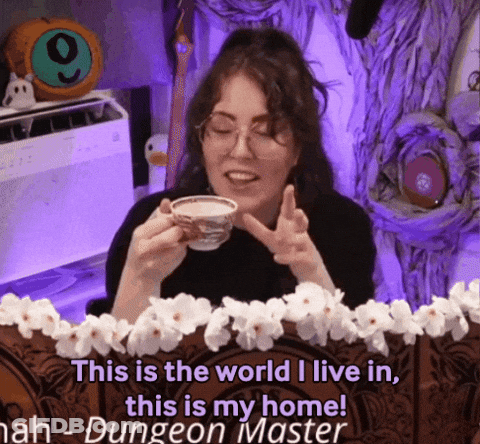 A Woman Is Holding A Cup Of Coffee And Says " This Is The World I Live In This Is My Home ! " GIF