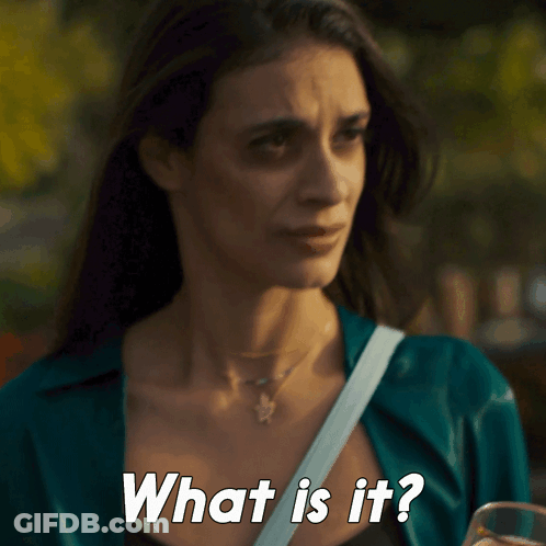 A Woman Is Holding A Glass Of Beer And Asking What Is It GIF