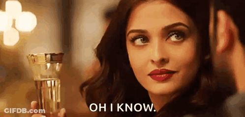 A Woman Is Holding A Glass Of Water And A Man Is Looking At Her . GIF