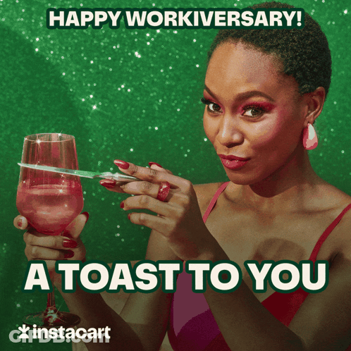 A Woman Is Holding A Glass Of Wine And A Pair Of Scissors And Says Happy Workiversary GIF