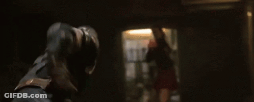 Woman Holding Gun In Dark Room With Keys GIF