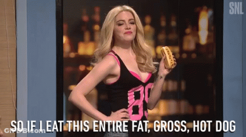 A Woman Is Holding A Hot Dog And Saying `` So If I Eat This Entire Fat , Gross , Hot Dog '' GIF