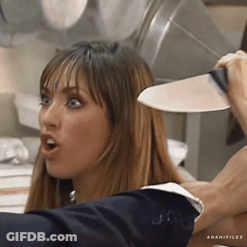 A Woman Is Holding A Knife Over Her Head And The Word Anahifiles Is On The Bottom GIF